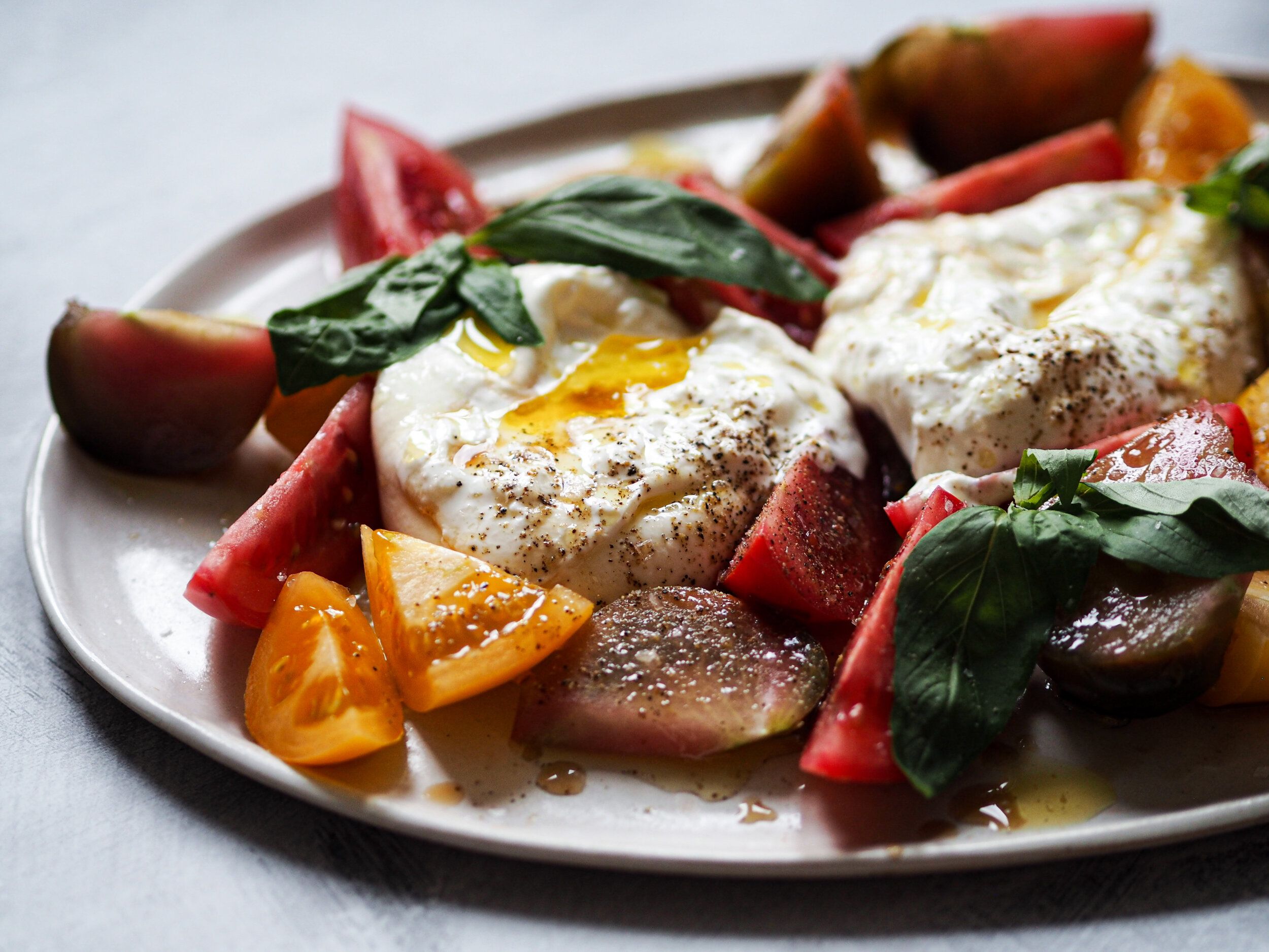 Burrata, micro greens, heirloom tomatoes.jpeg