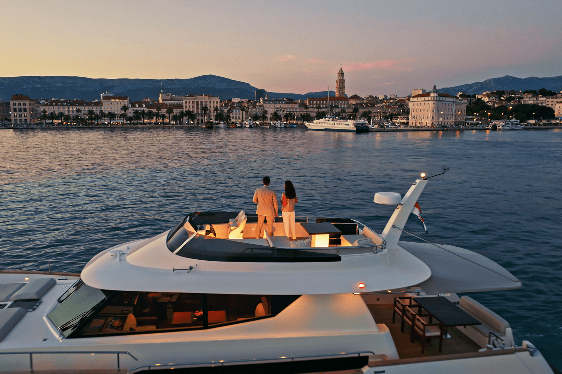 Couple in Yacht Deck Enjoying the Sunset.png